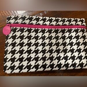 Ipsy black and white cosmetic bag with pink lining